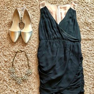 McGinn ruched black cocktail dress with sheer nude back